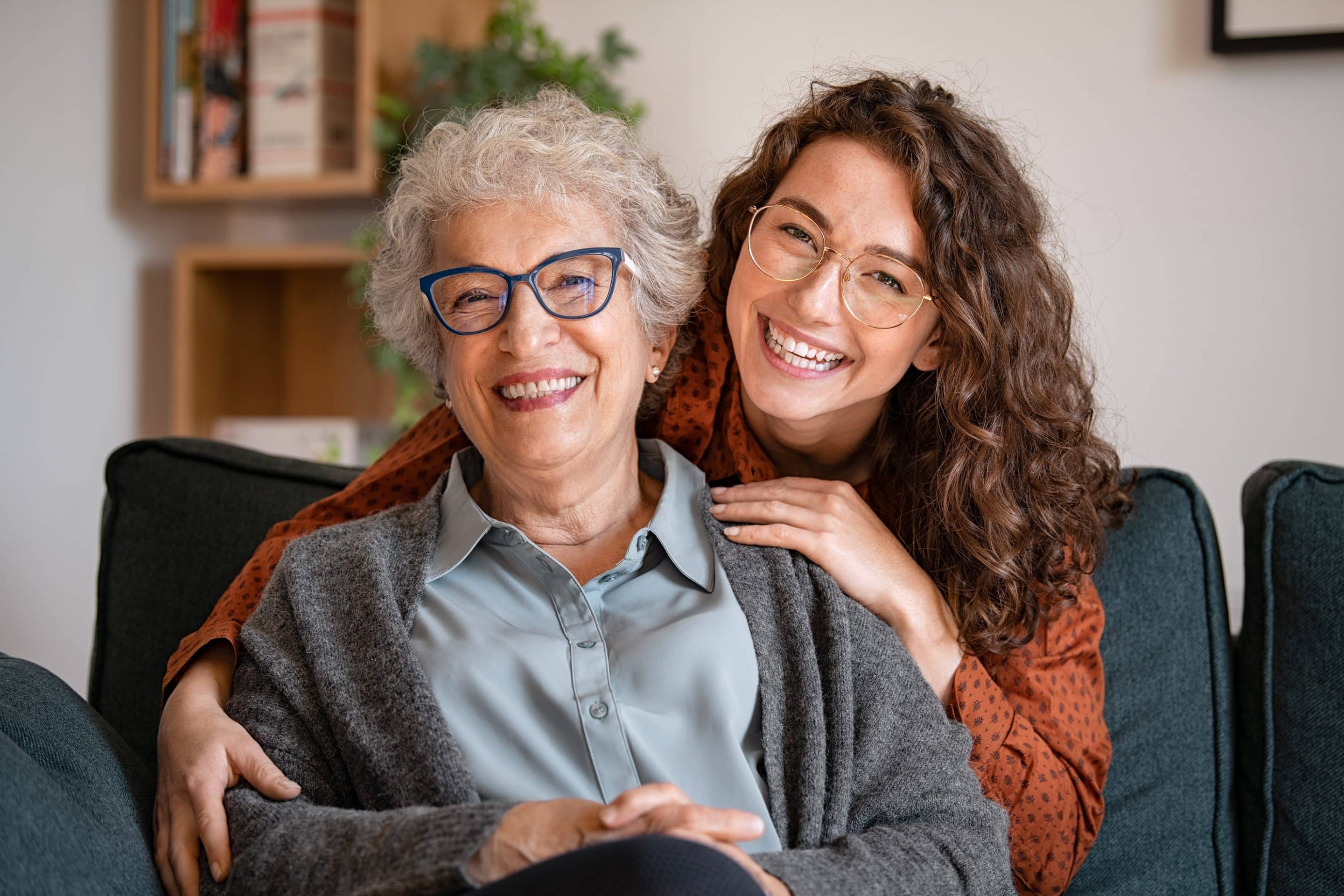 two women wearing glasses hugging - Mountain Brook, AL