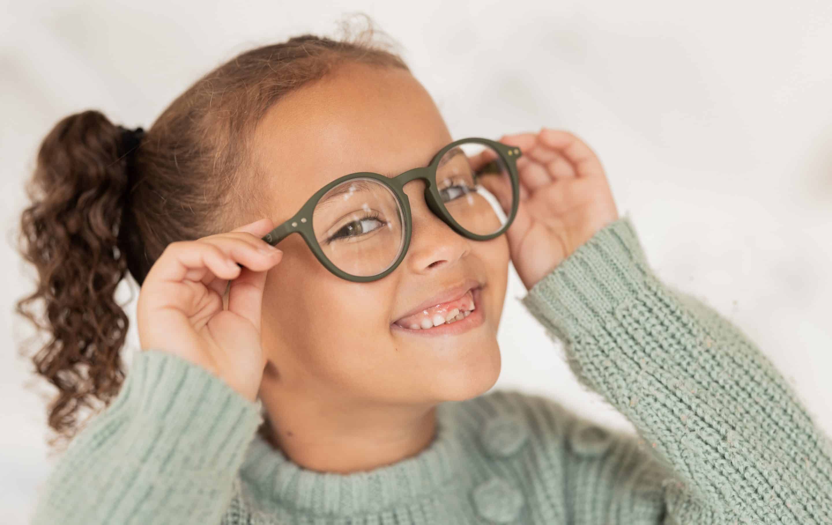 Little girl showing off her glasses in Mountain Brooke AL